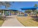 Community playground featuring shade structures and play equipment for children at 5226 W Pontiac Dr, Glendale, AZ 85308
