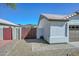 Charming home featuring a well-manicured front yard, desert landscaping, brick pathway and wooden gate at 5226 W Pontiac Dr, Glendale, AZ 85308
