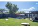 Spacious backyard features a sparkling pool, green lawn, and ample seating space at 5809 N 10Th Pl, Phoenix, AZ 85014