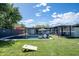 Backyard oasis offers a refreshing pool, lush lawn, and shaded seating at 5809 N 10Th Pl, Phoenix, AZ 85014