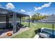 Landscaped backyard offers a shaded pergola seating area and swimming pool for outdoor enjoyment at 5809 N 10Th Pl, Phoenix, AZ 85014