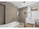 Chic bathroom showcases a soaking tub, tiled shower, and marble countertops at 5809 N 10Th Pl, Phoenix, AZ 85014