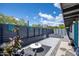 Stylish courtyard with sleek fencing, modern seating, and serene water feature at 5809 N 10Th Pl, Phoenix, AZ 85014