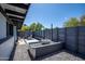 Private courtyard boasts a cozy lounge area and artistic rock arrangement at 5809 N 10Th Pl, Phoenix, AZ 85014