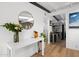 Entryway featuring modern white desk and a view into an open kitchen at 5809 N 10Th Pl, Phoenix, AZ 85014
