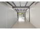 Bright garage with white cabinets and glass door leading outdoors at 5809 N 10Th Pl, Phoenix, AZ 85014