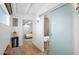 Bright hallway leading to the bathroom, with neutral walls and door to the bedroom at 5809 N 10Th Pl, Phoenix, AZ 85014