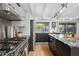 Bright kitchen featuring stainless steel appliances, granite countertops, and hardwood floors at 5809 N 10Th Pl, Phoenix, AZ 85014