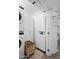 Functional laundry room with stacked washer and dryer, built-in storage and laundry basket at 5809 N 10Th Pl, Phoenix, AZ 85014