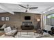 Inviting living room features modern furniture, wood wall, and a ceiling fan at 5809 N 10Th Pl, Phoenix, AZ 85014