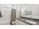 Clean bathroom features a shower-tub combo, granite countertop vanity, and decorative framed art at 5824 E Axle Ln, San Tan Valley, AZ 85140