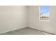 Bright bedroom with neutral walls and carpet, window offers expansive desert views at 5824 E Axle Ln, San Tan Valley, AZ 85140