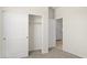 Bright bedroom features neutral carpet and a closet with sliding doors at 5824 E Axle Ln, San Tan Valley, AZ 85140