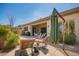 Backyard patio featuring outdoor seating, a BBQ grill, and beautiful landscaping for outdoor enjoyment at 6094 E Evening Glow Dr, Scottsdale, AZ 85266