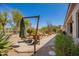 Enjoy the beautiful desert views on the backyard patio with shade umbrella and comfortable chairs for relaxation at 6094 E Evening Glow Dr, Scottsdale, AZ 85266