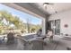 Covered patio overlooking the lush backyard with views of golf course, and the mountains at 6094 E Evening Glow Dr, Scottsdale, AZ 85266