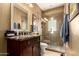 Elegant bathroom featuring a vanity with sink and a glass-enclosed shower with tiled accents, blending style and functionality at 6094 E Evening Glow Dr, Scottsdale, AZ 85266