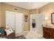 Bright bedroom featuring a closet and a glimpse into the adjacent bathroom, offering convenience and functionality at 6094 E Evening Glow Dr, Scottsdale, AZ 85266