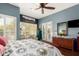 Well-lit bedroom with shuttered windows and a scenic desert view at 6094 E Evening Glow Dr, Scottsdale, AZ 85266