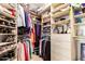 Organized walk-in closet with ample shelving and storage space for clothes and accessories at 6094 E Evening Glow Dr, Scottsdale, AZ 85266