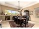 Elegant dining room features a large window with desert views and a striking black dining set at 6094 E Evening Glow Dr, Scottsdale, AZ 85266
