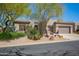 Charming single-story home featuring desert landscaping, a private driveway and a two-car garage at 6094 E Evening Glow Dr, Scottsdale, AZ 85266