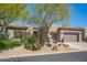 Exterior view of a single Gathering home featuring a desert landscaped front yard and a 3 car garage at 6094 E Evening Glow Dr, Scottsdale, AZ 85266