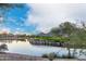Picturesque view of a lush golf course with a serene lake and mountain backdrop on a sunny day at 6094 E Evening Glow Dr, Scottsdale, AZ 85266