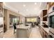 Open kitchen area showcasing an expansive island and seamless transition to the adjacent living space at 6094 E Evening Glow Dr, Scottsdale, AZ 85266