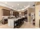 Spacious kitchen with an oversized island, stainless appliances, and ample dark wood cabinetry at 6094 E Evening Glow Dr, Scottsdale, AZ 85266