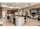 Spacious kitchen with a large island, marble countertops, and seamless flow into the living area at 6094 E Evening Glow Dr, Scottsdale, AZ 85266