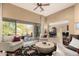 Open living area with neutral walls, ceiling fan, and sliding door to the backyard patio at 6094 E Evening Glow Dr, Scottsdale, AZ 85266