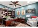 Home office with built-in shelving, a wooden desk, and comfortable seating at 6094 E Evening Glow Dr, Scottsdale, AZ 85266