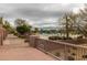 Community pool featuring lounge chairs, umbrellas, desert landscaping, and walking path for residents enjoyment at 6094 E Evening Glow Dr, Scottsdale, AZ 85266