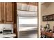 Gourmet kitchen featuring stainless steel refrigerator with wood cabinets at 6094 E Evening Glow Dr, Scottsdale, AZ 85266