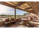 Covered patio with views of the community golf course and desert landscape at 6094 E Evening Glow Dr, Scottsdale, AZ 85266