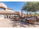 Outdoor restaurant patio with tables, chairs and umbrellas for shaded dining at 6094 E Evening Glow Dr, Scottsdale, AZ 85266