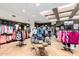 Upscale retail space with modern displays of clothing and accessories on tables and racks at 6094 E Evening Glow Dr, Scottsdale, AZ 85266