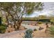 Tennis court with desert foliage in the background at 6094 E Evening Glow Dr, Scottsdale, AZ 85266