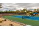 A shot of the Terravita tennis court with cacti and desert plants around it at 6094 E Evening Glow Dr, Scottsdale, AZ 85266
