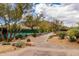 Tennis courts surrounded by desert landscaping at 6094 E Evening Glow Dr, Scottsdale, AZ 85266