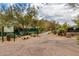 Tennis courts surrounded by desert landscaping at 6094 E Evening Glow Dr, Scottsdale, AZ 85266