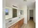 Bright bathroom is equipped with dual sinks, a soaking tub, and a separate shower at 6602 S 23Rd Ave, Phoenix, AZ 85041