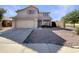 Two-story home features a well-maintained facade with a two car garage and a low maintenance front yard at 6602 S 23Rd Ave, Phoenix, AZ 85041
