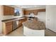 Well-equipped kitchen features stainless steel appliances, ample counter space, and abundant cabinet storage at 6602 S 23Rd Ave, Phoenix, AZ 85041