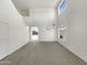 Bright living room featuring neutral carpet, white walls, and large windows for natural light at 6602 S 23Rd Ave, Phoenix, AZ 85041