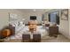 Bright living room offers stylish furniture, hardwood flooring, and an area rug for a warm and inviting atmosphere at 6602 S 23Rd Ave, Phoenix, AZ 85041