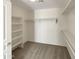 Spacious walk-in closet with shelving and hanging racks, offering ample storage at 6602 S 23Rd Ave, Phoenix, AZ 85041