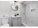 Updated bathroom showcasing a walk-in shower with marble tile and modern fixtures at 6823 W Coolidge St, Phoenix, AZ 85033
