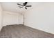 Bedroom with carpet, ceiling fan and closet space; bright and spacious at 6823 W Coolidge St, Phoenix, AZ 85033